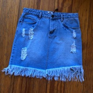Distressed blue jean mini skirt